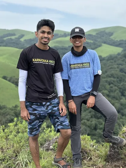 Two of our trek leads posing on the beautiful green slopes of Bandaje.