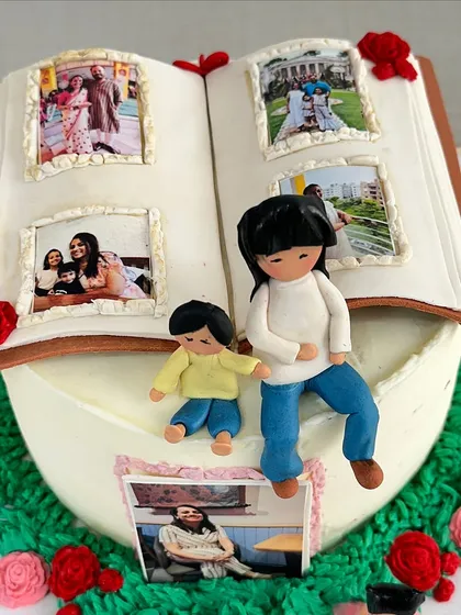 I believe every cake tells a story. This special 40th birthday cake was designed as a photo album, featuring edible pictures of cherished family memories and handmade figures of a mother and her children.