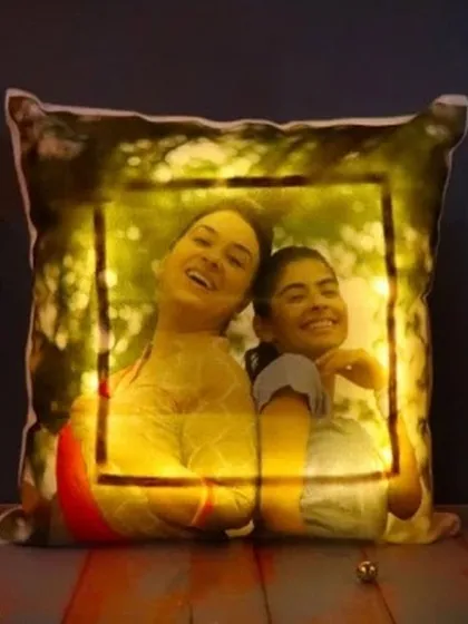 Surprise them with a personalized LED cushion that literally glows. Your photo is printed on the front, and with the flick of a switch, the border lights up, making it a unique and cozy addition to any room.