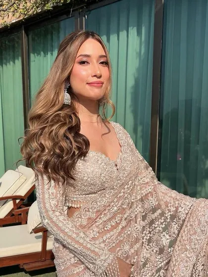 The volume and texture of these Hollywood waves are just perfect. This is a go-to style for creating a glamorous and confident look for a reception or cocktail party.