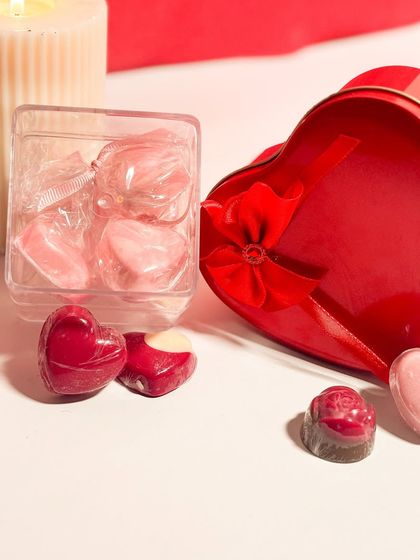 A collection of my heart shaped chocolates for Valentine's Day. These handmade chocolates come in different shapes and fillings, available in small gift boxes or as part of a larger assortment.