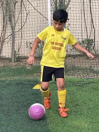 A player practicing his dribbling. Our 1-on-1 training focuses on each child's unique needs and potential.