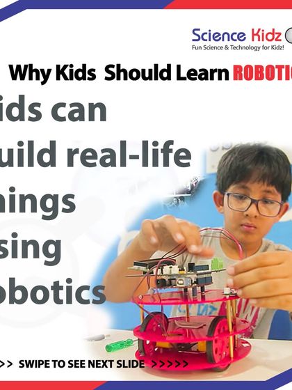 Why should kids learn robotics? Because it allows them to build real-life things. This image shows a student working on a wheeled robot, turning abstract science and math concepts into a tangible, working machine.