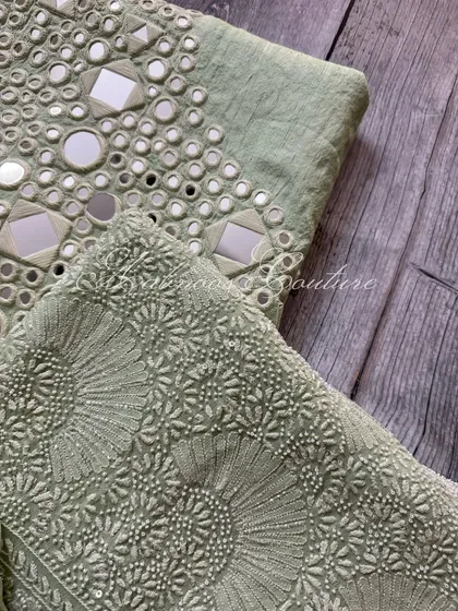 A close-up of the georgette kurta fabric, showing the 'Teen Taar' heavy jaal work with Poth, Kutdana, and sequin embellishments.