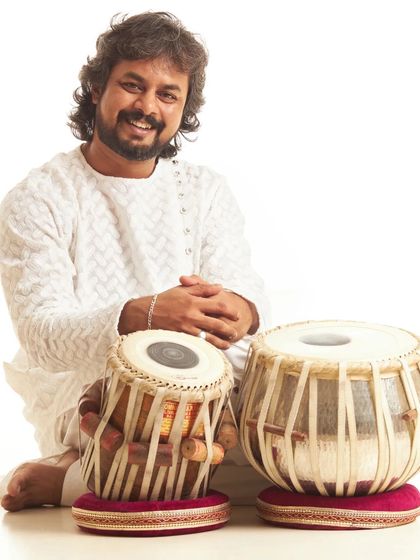 A smiling studio portrait.