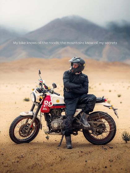 A moment of pause in the vast desert landscape of Ladakh with the Royal Enfield Scram. This shot is about the relationship between the rider, the machine, and the mountains. It's this kind of storytelling image that builds a powerful connection with the brand's audience.