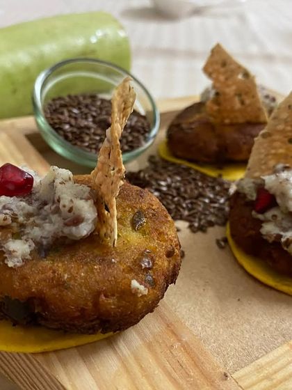 These Lauki Musallam tikkis are a healthy yet delicious option. Made from bottle gourd and spices, they are served on a crispy base and topped with a flavorful chutney.