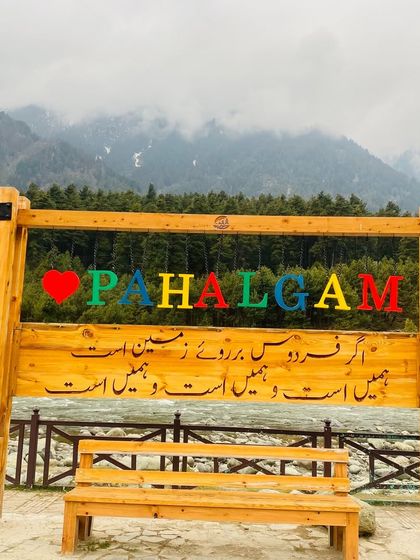 The iconic 'I Love Pahalgam' sign in Kashmir. A perfect spot for a group photo to remember the beautiful places we visit together.