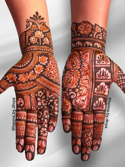 A dense and detailed Indian mehendi design. This piece showcases a variety of patterns, including lotus flowers, paisleys, and checkered fills, creating a rich tapestry on the hands.