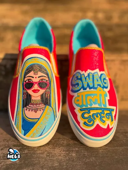 A front-on view of the complete "Swag Wali Dulhan" custom sneaker pair.