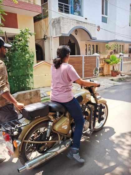 A student practices moving the bike with the engine off. This helps build a feel for the machine's balance and weight in a completely safe setting.