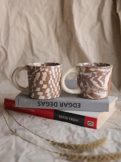 The 'Check / Uncheck' Nerikomi cup set. These little cups are perfect for an espresso shot or a cutting chai. I created the patterns by layering and slicing different colored clays.