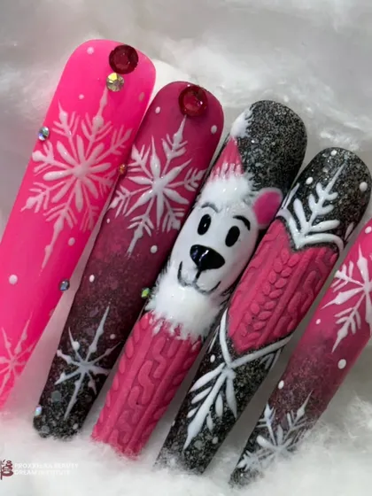 A festive and fun winter-themed set of nail tips, featuring a cute polar bear, snowflakes, and a cozy sweater texture in a bright pink and black color scheme.