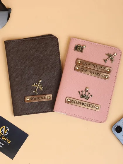 A side-by-side look at two of my personalized passport covers in brown and pink, showing different customization options for him and her.