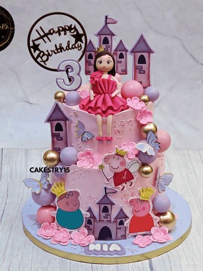 A fun and colorful two-tier Peppa Pig cake. This choco-vanilla cake features Peppa, George, and a castle, all in a playful pink and purple design perfect for a third birthday.