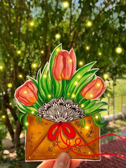 A beautiful bouquet of tulips emerges from an envelope, with a black and white mandala peeking out from inside. This piece blends floral illustration with detailed pattern work.