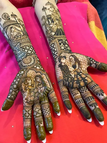 A full view of a stunning portrait mehandi, capturing different romantic poses of the couple on each palm and forearm, telling a story across both hands.