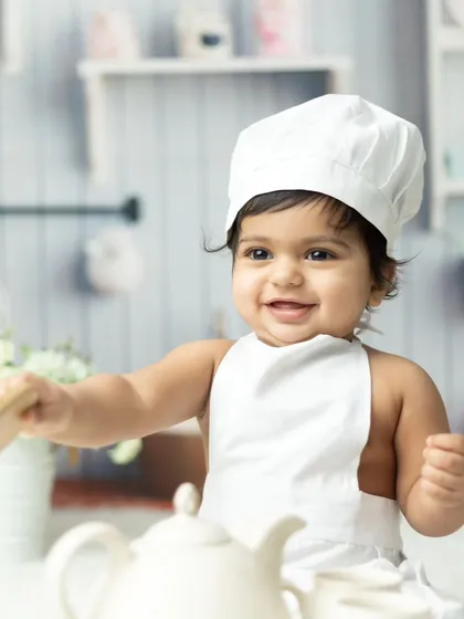 Meet the little chef. Our themed photoshoots are all about fun and imagination, bringing your child's playful personality to life with creative costumes and props.