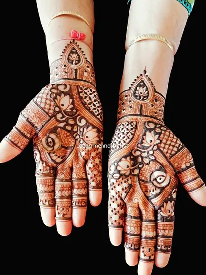A lovely and intricate design for a wedding guest. The pattern is filled with lotus motifs and paisleys, creating a full and festive look.