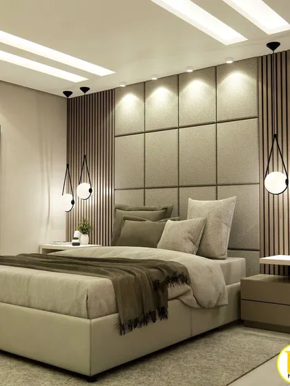 This bedroom design uses a mix of textures, including an upholstered grid-patterned headboard and vertical wood slats. The stylish pendant lights on either side of the bed add a modern, decorative touch.