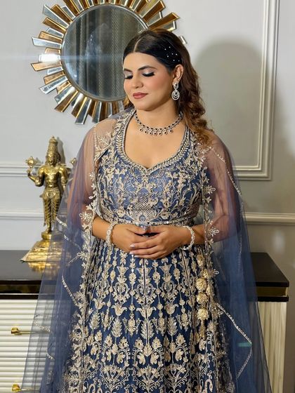 A three-quarter view of the client, showing the hairstyle and makeup from another angle.