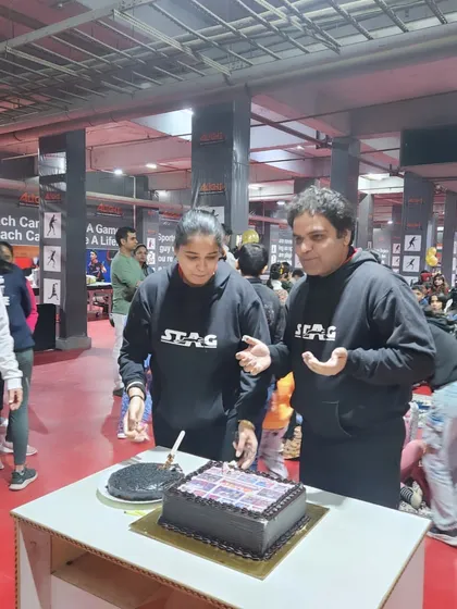 Cutting the cake to celebrate another year of success, growth, and community at Alight Table Tennis Excellence Centre.