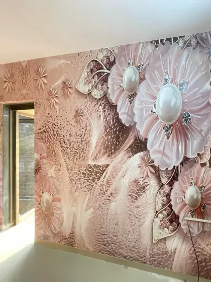 A beautiful 3D wallpaper with large, textured pink flowers, adding a touch of glamour and sophistication to this room.