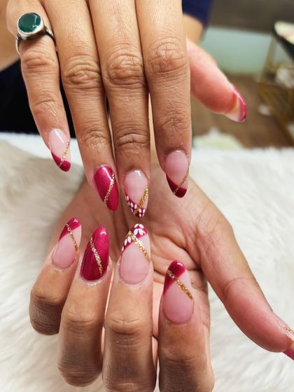 A final look at the elegant red, gold, and white festive nail art, perfect for any holiday celebration.