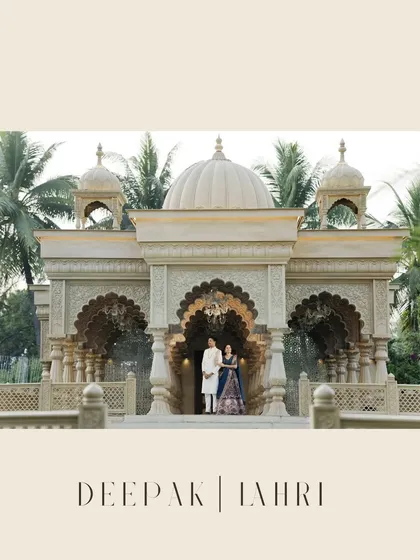 A grand pre-wedding portrait in front of a beautiful, temple-like structure, showcasing a blend of architectural beauty and romantic elegance.