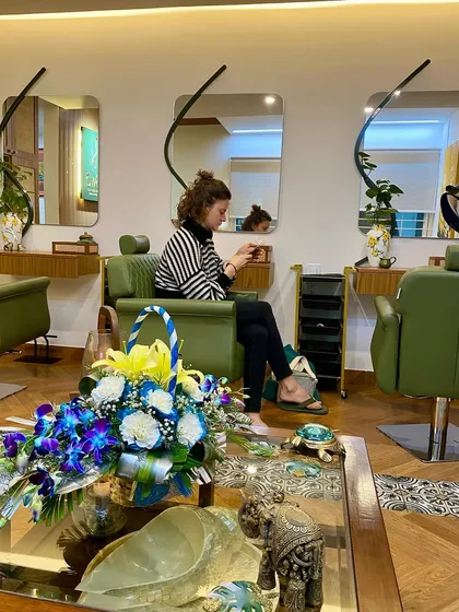 A client taking a moment for herself in our serene salon environment.