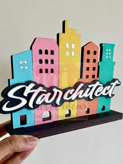 An angled view of the 'Starchitect' standee, highlighting the 3D effect of the design.