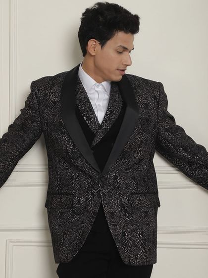 Another angle of the black and silver tuxedo, showing its sharp fit and modern style.