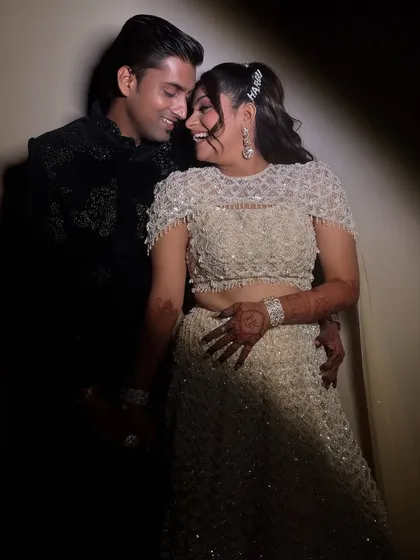 Capturing the pure joy of a sangeet night. The bride is glowing in her custom glam look, complete with a chic high ponytail, ready to dance the night away with her partner. These are the moments I live for.