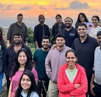 The group at the Anthargange viewpoint, just as the sun begins to rise, casting a golden glow on the landscape.