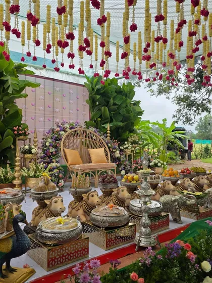 An angled view of the outdoor baby shower decor, highlighting the hanging floral ceiling.
