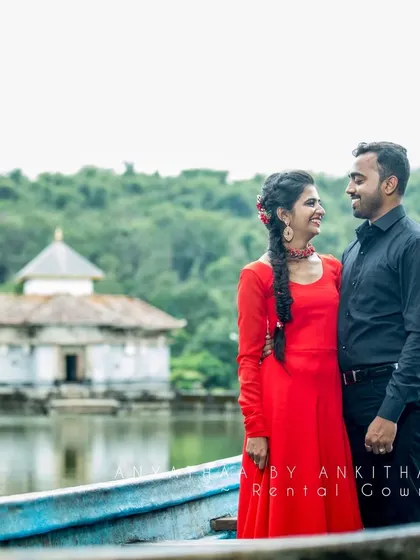 A close-up of the couple by the lake, with the bride-to-be looking radiant in my rental red gown.
