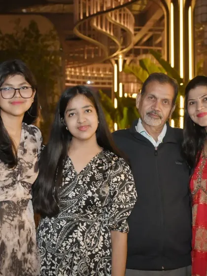 A multi-generational family portrait with grandparents, parents, and children. We are skilled at arranging and photographing large family groups at events.