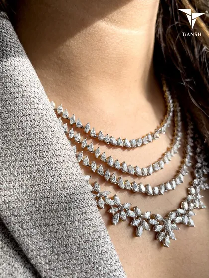 Why choose one layer of sparkle when you can have them all? This layered diamond necklace is designed for the modern woman who loves clean lines and effortless glamour. It is a statement of confidence that is both bold and sophisticated.