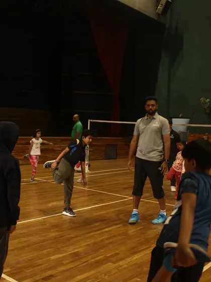 Young players participating in a warm-up stretching session, an important part of our injury prevention and fitness routine.