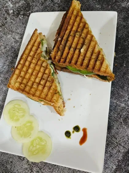 A perfectly grilled sandwich with a side of cucumber, a quick and satisfying meal you'll learn in our cafe course.