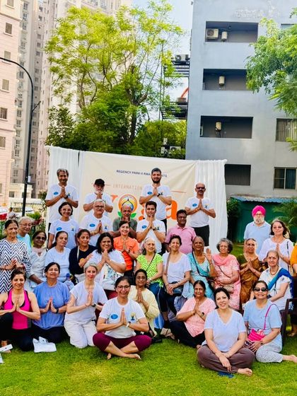 A group photo with participants from the International Yoga Day event. It's a joy to see so many smiling faces after a session dedicated to wellness and shared practice.