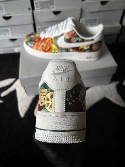 A heel view of the cinema-themed custom sneakers, showing the classic drama masks.