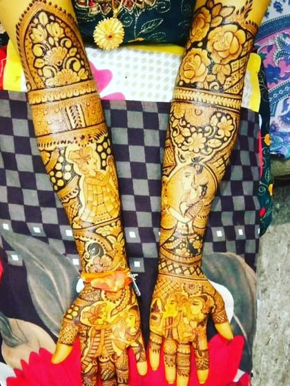 This design is filled with multiple figures and scenes. It tells the story of the wedding from the ceremony to the vidaai, with portraits of the couple and their families.