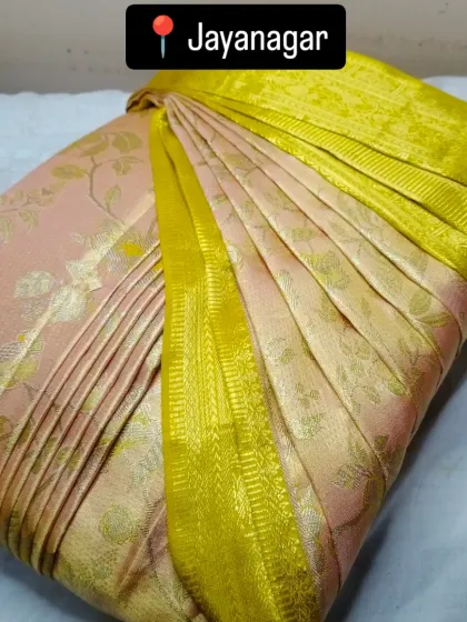 This wedding season, drape your sarees with perfection and ease, like this beautiful pink and yellow one.