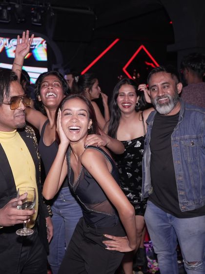 More happy faces from the launch party at Mirror Rooftop club, showing a group of friends having an amazing time.