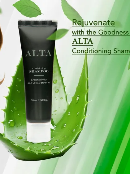 This is a creative infographic shot focusing on a single conditioning shampoo, using natural elements like aloe vera to visually communicate the product's benefits.