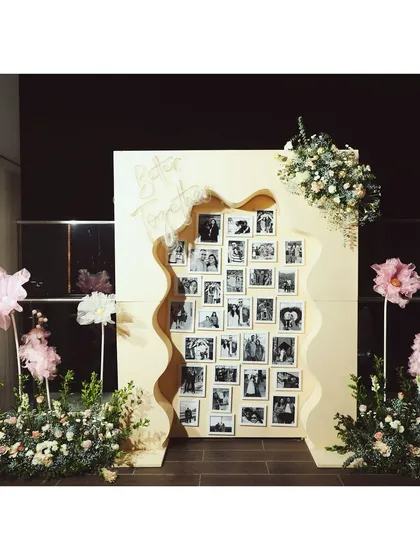 We create personalized installations like this "Better Together" photo memory wall. It serves as a beautiful backdrop and a heartfelt tribute, showcasing cherished moments for guests to enjoy.