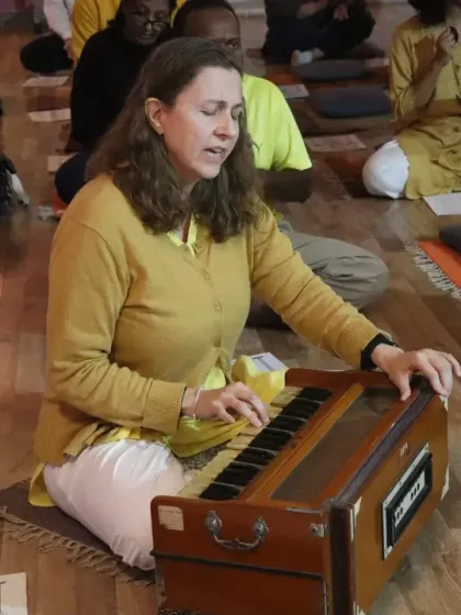 A student plays the harmonium, leading the kirtan during our Maha Shivaratri celebration. Music and chanting are integral parts of our devotional practices, elevating the collective energy.