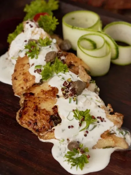 If only taking a picture made the food last longer. This beautifully pan-seared fish is draped in a creamy herb sauce, a simple yet elegant main course.
