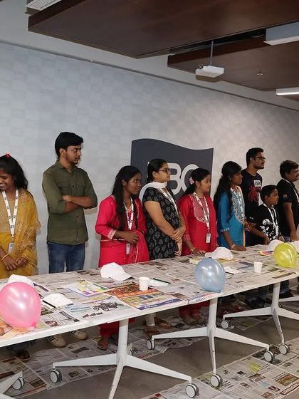 The kids from Sneha Shraya Foundation all lined up and ready to paint their caps at the HBC corporate event.